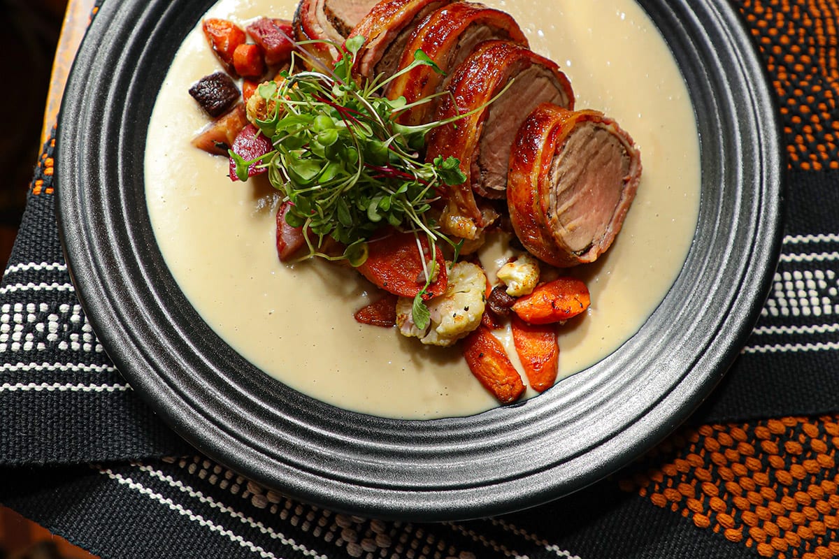 A plated tenderloin and vegetables at Fonda San Miguel