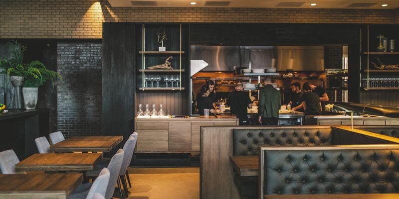 The dining room and open kitchen at Hestia