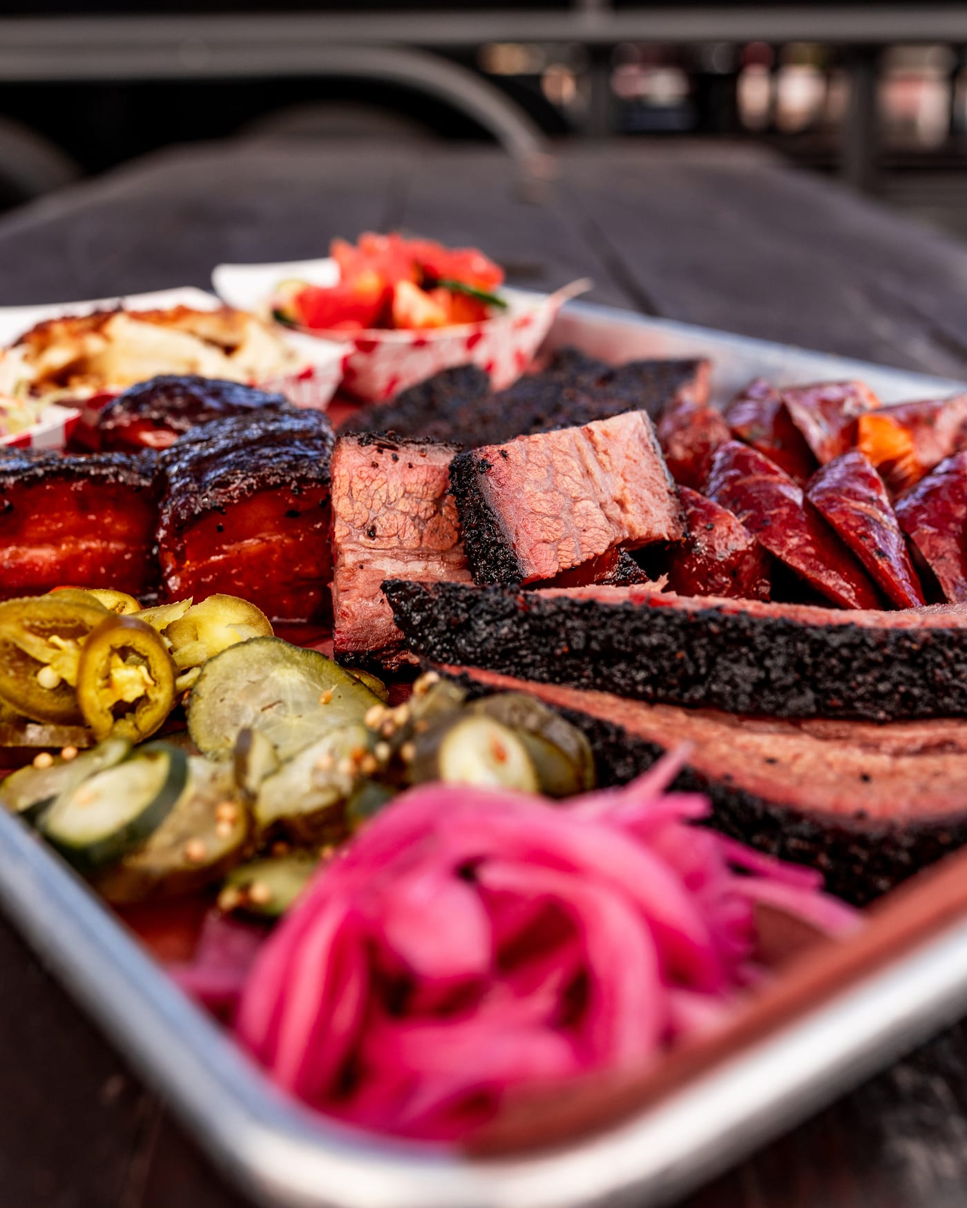 A barbecue tray with pickles and sides from InterStellar BBQ