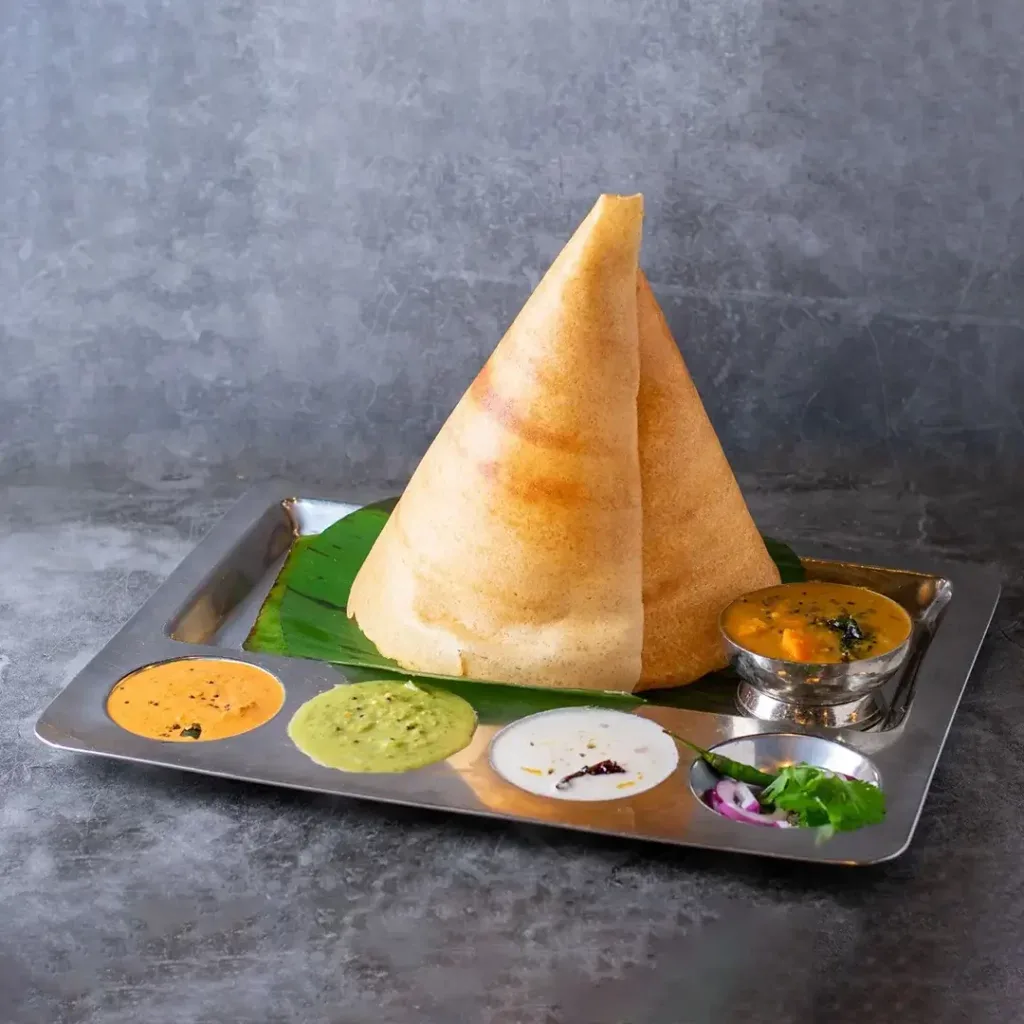 A ghee roast dosa and accompaniments at Sangam Chettinad