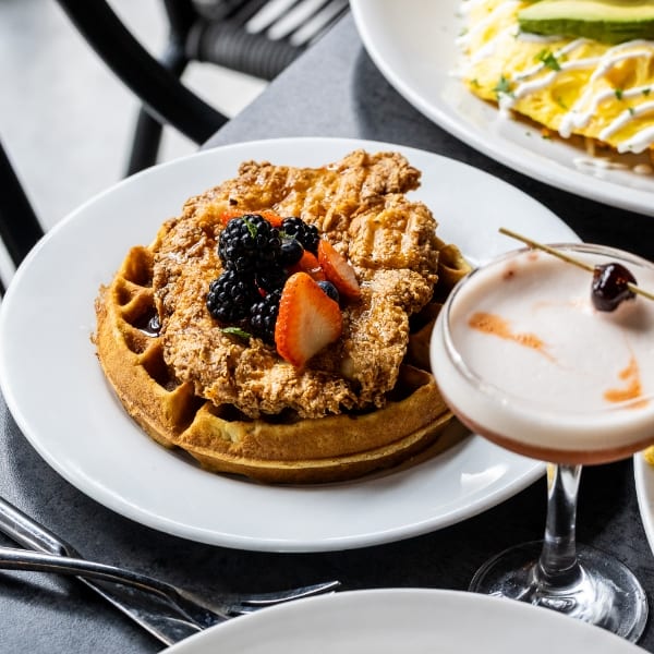 Chicken and waffles with berries. URBAN Eat.Drink.