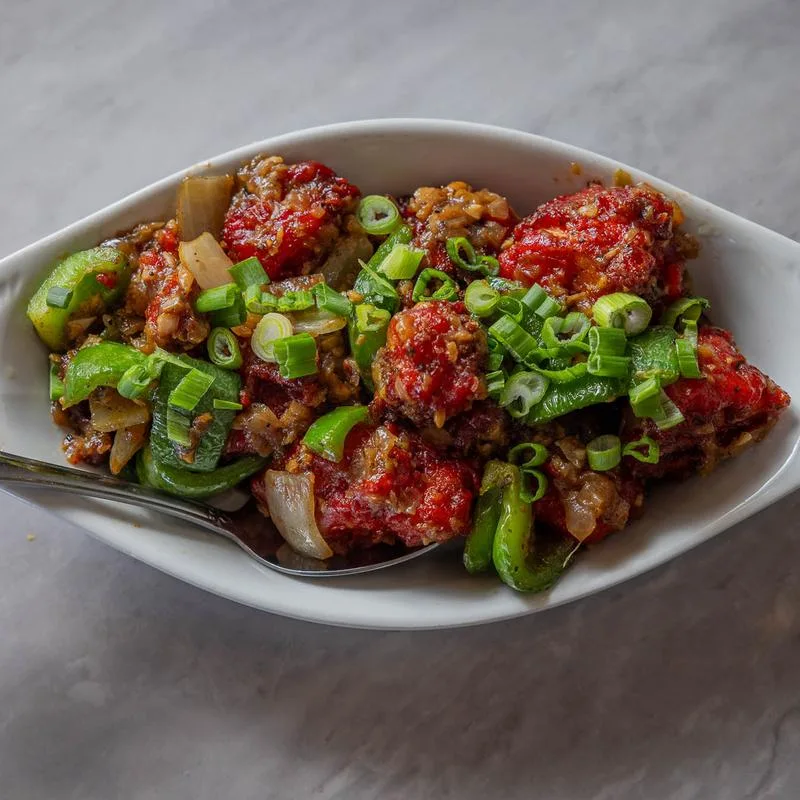 Indian dish with peppers and green onions at Asiana