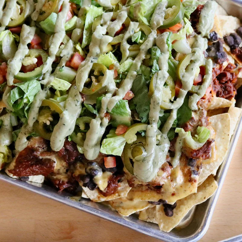 Tacos with vegetables and sauce at Industry