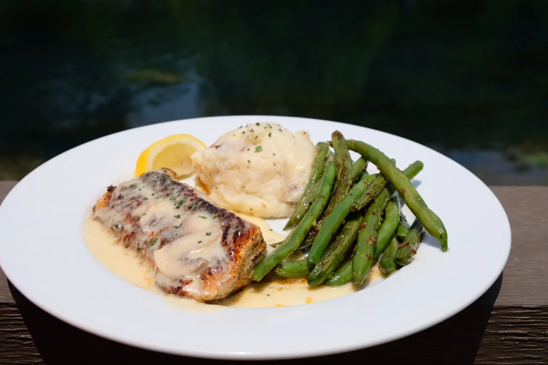 Fish with mashed potatoes and asparagus at Ivar’s River Pub