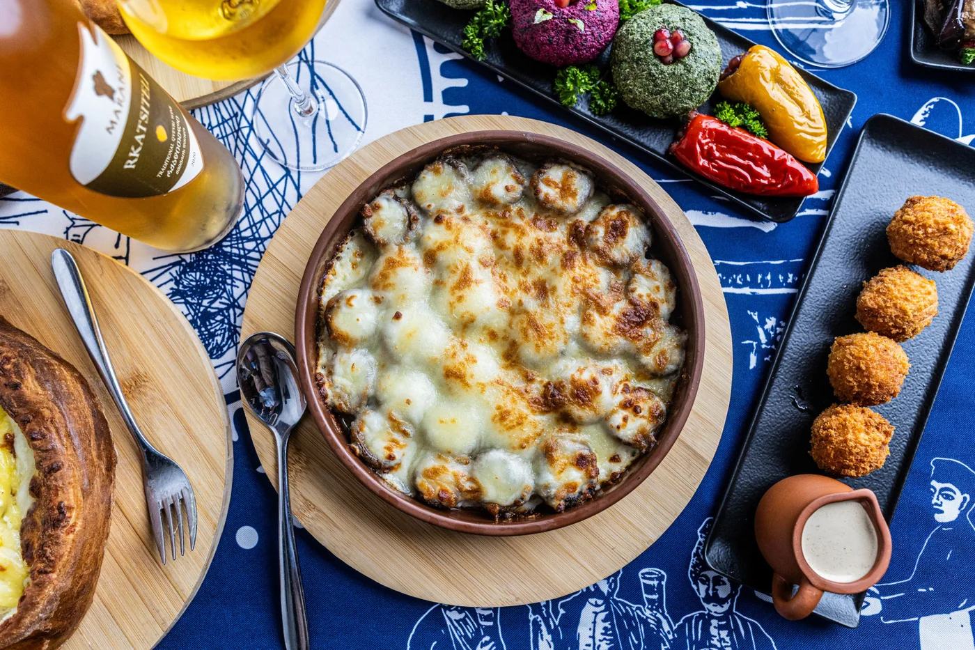 Georgian dishes arranged on a table at Nikala
